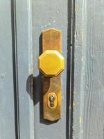 Close up of a metal lock at a closed Door photo