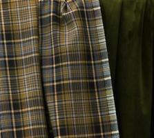 Detailed close up view on samples of cloth and fabrics in different colors found at a fabrics market photo