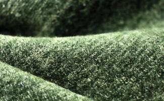 Detailed close up view on samples of cloth and fabrics in different colors found at a fabrics market photo