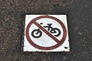 Painted bicycle signs on asphalt found in the city streets of Germany. photo