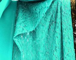 Detailed close up view on samples of cloth and fabrics in different colors found at a fabrics market photo