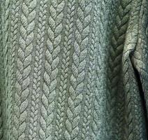 Detailed close up view on samples of cloth and fabrics in different colors found at a fabrics market photo