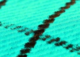Detailed close up view on samples of cloth and fabrics in different colors found at a fabrics market photo