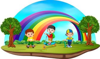 niños jugando en el parque el día del arco iris vector