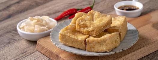 Deep fried stinky tofu with pickled cabbage street food in Taiwan. photo