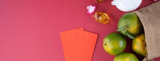 Top view of fresh tangerine mandarin orange on red background for Chinese lunar new year. photo