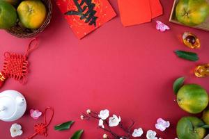 Top view of fresh tangerine mandarin orange on red background for Chinese lunar new year. photo