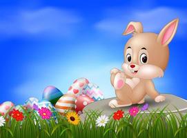 Easter bunny and eggs sitting on the stone vector