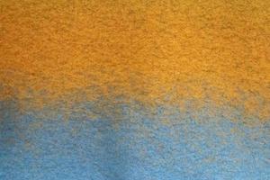 Detailed close up view on samples of cloth and fabrics in different colors found at a fabrics market photo
