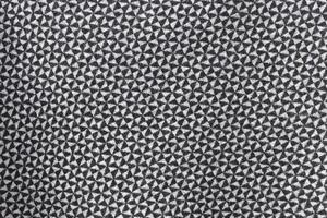 Detailed close up view on samples of cloth and fabrics in different colors found at a fabrics market photo