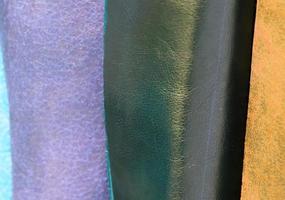 Detailed close up view on samples of cloth and fabrics in different colors found at a fabrics market photo