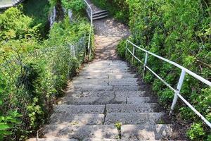 Different outdoor views on concrete, wooden and metal stairways. photo