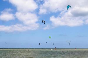 Lots of kite surfing activity at the Baltic Sea beach of Laboe in Germany on a sunny day. photo