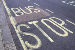 Different signs and marking painted on the ashpalt of streets and roads. photo