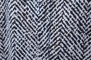 Detailed close up view on samples of cloth and fabrics in different colors found at a fabrics market photo
