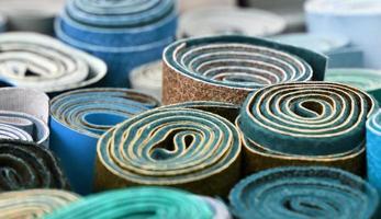 Detailed close up view on samples of cloth and fabrics in different colors found at a fabrics market photo