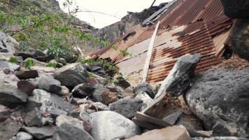 Metal tin roofing and rocks in rubble pile video