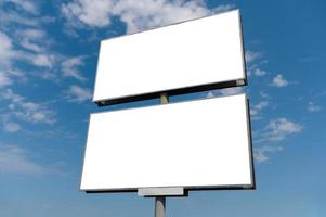 Billboard white blank with room to add your own text. Background with white cloud and blue sky for outdoor advertising, banners with clipping path photo