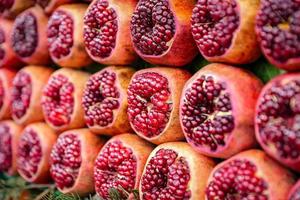 Group of half pomegranates photo