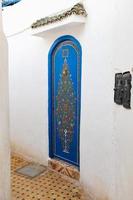 Door of a building in Kasbah of the Udayas in Rabat, Morocco photo