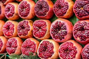 Group of half pomegranates photo