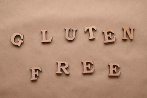 Letters Gluten free on a paper background. photo