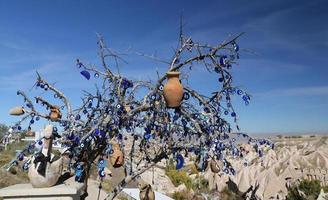 Evil Eye Beads Tree in Pigeons Valley, Cappadocia, Nevsehir, Turkey photo