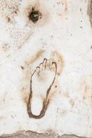 Footprint on Marble for advertisement of the Brothel in Ephesus, Turkey photo