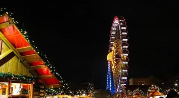 Ferris Wheel in Neptunbrunnen Christmas Market in Berlin, Germany photo