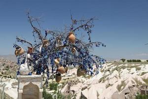 Pigeons Valley and Evil Eye Beads Tree in Cappadocia photo