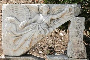 Stone carving of the goddess Nike in Ephesus Ancient City photo