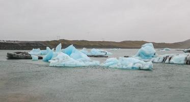 Icebergs in Jokulsarlon Glacial River Lagoon, Iceland photo