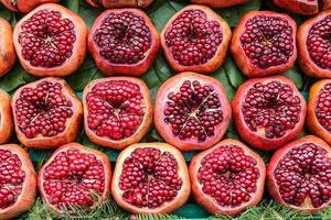 Group of half pomegranates photo