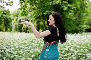 Portrait of beautiful indian brumette girl or hindu woman model. Traditional Indian costume lehenga choli. photo