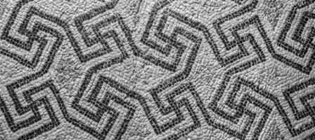 Swastika symbol in ancient Celtic mosaic decoration. Design for an old style background. photo