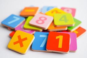 Number wood block cubes for learning Mathematic, education math concept. photo