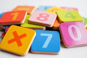 Number wood block cubes for learning Mathematic, education math concept. photo