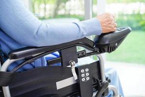 Asian elderly woman disability patient walk with walker in nursing hospital, medical concept. photo