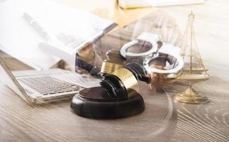 Male lawyer working with contract papers and wooden gavel on tabel in courtroom. justice and law ,attorney, court judge, concept. photo