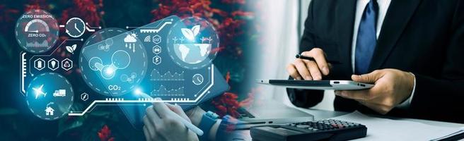 Selective focus. Architect team planning design apply renewable or solar energy on architectural building model with virtual reality technology hologram. Alternative green energy in future concept. photo