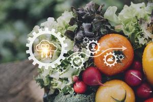 Futuristic businessman farms vegetables and crops using modern AI technology using mobile phones, temperature and humidity sensors, water tracking, climate control, holographic data data icons. photo