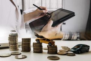 Businessman and team analyzing financial statement Finance task. with smart phone and laptop and tablet. Wealth management concept photo