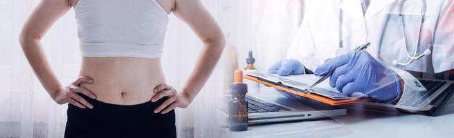 Fat woman hand holding excessive belly fat with measuring tape on white background. Shape up healthy stomach muscle and diet lifestyle to reduce belly concept. photo