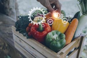 Futuristic businessman farms vegetables and crops using modern AI technology using mobile phones, temperature and humidity sensors, water tracking, climate control, holographic data data icons. photo