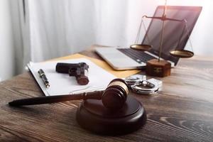 Business and lawyers discussing contract papers with brass scale on desk in office. Law, legal services, advice, justice and law concept picture with film grain effect photo