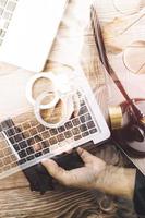 Business and lawyers discussing contract papers with brass scale on desk in office. Law, legal services, advice, justice and law concept picture with film grain effect photo