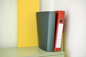 Yellow folder folder on the shelf inside the room photo