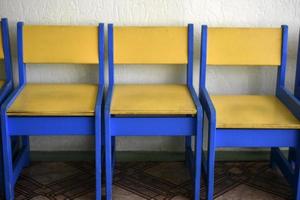 Yellow and blue baby stools in the game room photo