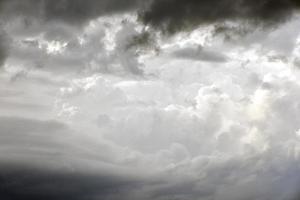 Black thunderstorm storm clouds on a summer day. Beautiful terrible thunderstorm. photo