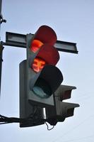 Red traffic light at the intersection. Counting red numbers at traffic lights. a forbidding signal on the road. photo